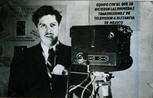 Guillermo González Camarena Standing next to a camera